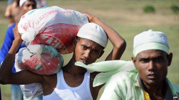 Rescued migrants, mostly Rohingyas from Myanmar and Bangladesh, arrive at the fishing town of Kuala Cangkoi in Ache, Indonesia