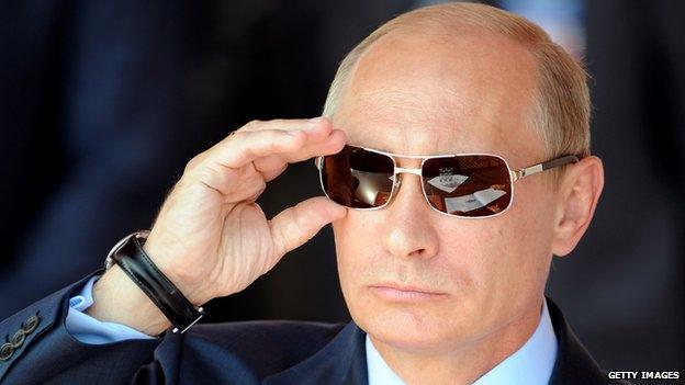 Vladimir Putin watches an air show in 2011