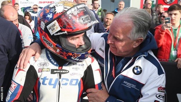 Alastair Seeley is embraced by his father after his Supersport triumph on Thursday