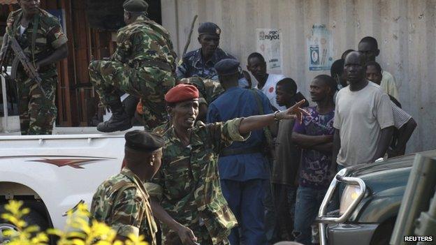 Burundi former Defence Minister Cyrille Ndayirukiye points to a direction during a attempted coup in the capital Bujumbura, on 13 May 2015.