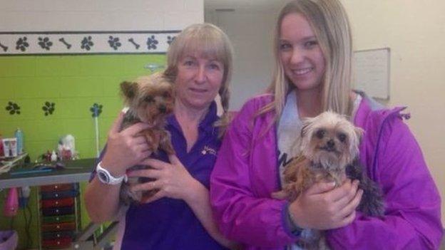 Happy Dogz staff pose with Boo and Pistol