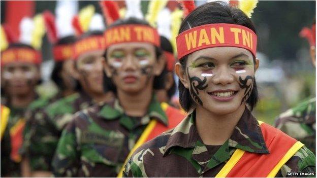 Female members of the Indonesian armed forces perform during a Kartini day ceremony