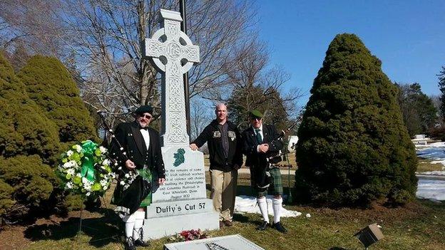 The memorial cross at Duffy's Cut grave at West Laurel Hill Cemetery, Bala Cynwyd, Pennsylvania. Included are Frank and Bill Watson and their colleague Earl Schandelmeier