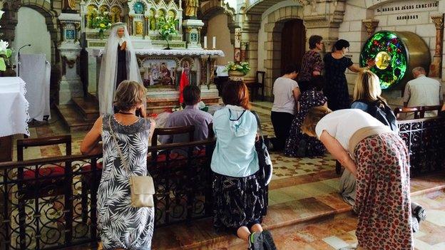 Pilgrims pray in chapel dedicated to Mariam Bawardy