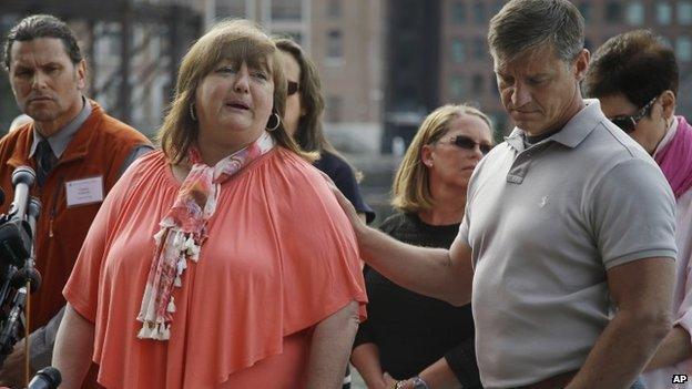 Liz Norden - whose two sons were injured in the attack - is consoled after the death penalty verdict for Dzhokhar Tsarnaev (15 May 2015)