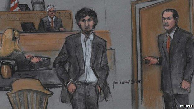 Boston Marathon bomber Dzhokhar Tsarnaev (centre) and US District Judge George O'Toole are shown in a courtroom sketch after Tsarnaev was sentenced at the federal courthouse in Boston (15 May 2015)