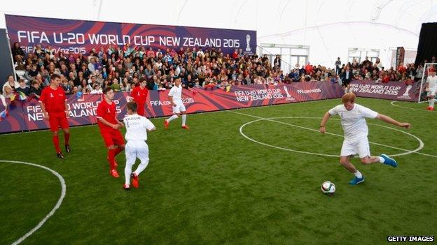 Prince Harry playing football