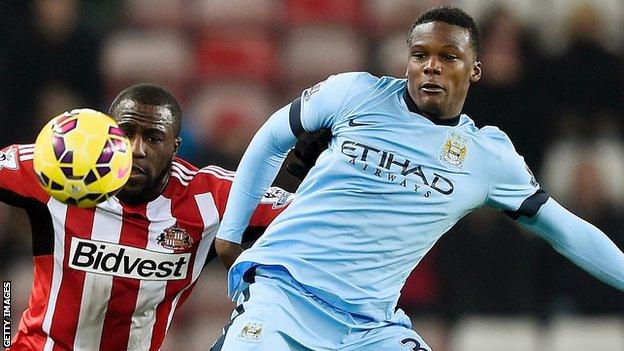 Dedryck Boyata (right) in action for Manchester City