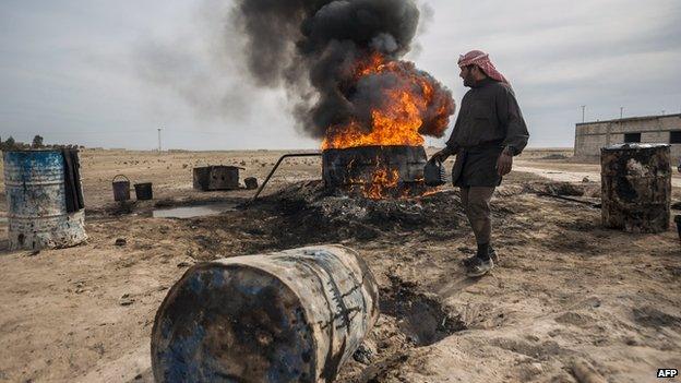 Archive photo of a farmer burning oil in Deir al-Zour province, Syria, 2013