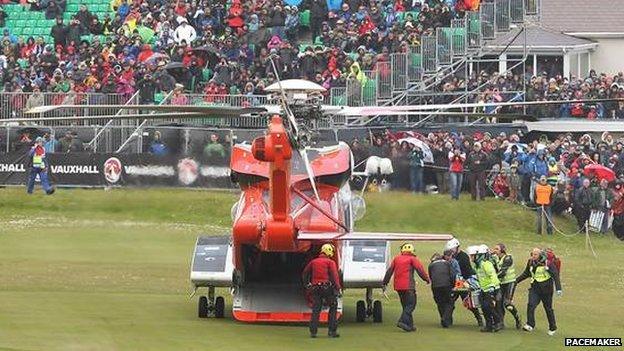 An air ambulance transfers an injured woman to hospital during the 2015 North West 200.