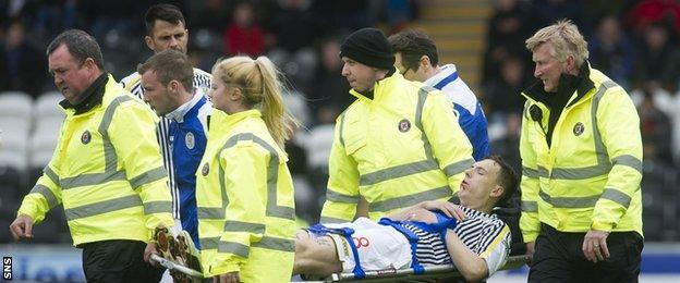 S Mirren's Alan Gow is stretchered off against Motherwell