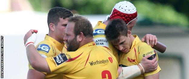 Scarlets celebrate their win in Treviso