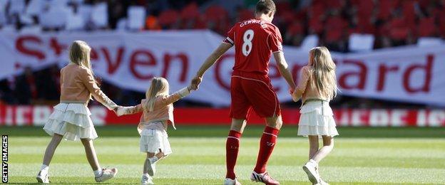 Steven Gerrard and his family on the pitch at Anfield