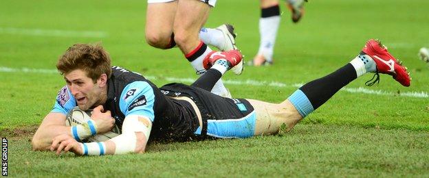 Richie Vernon plunges over for the all-important fourth try at Scotstoun