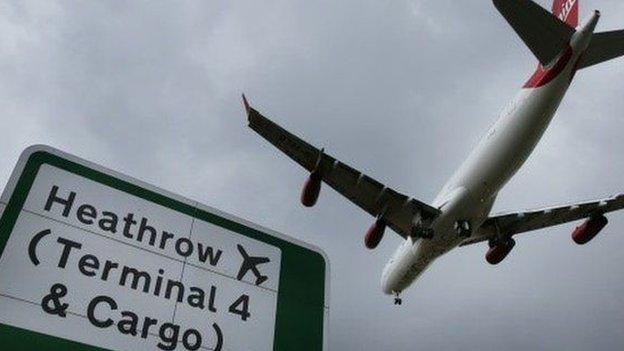 Plane comes in to land at Heathrow Airport