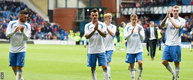 Queen of the South players applaud the travelling fans at full time