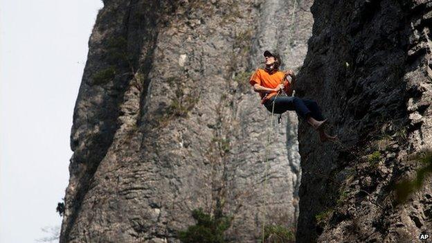 Dean Potter climbing rock face