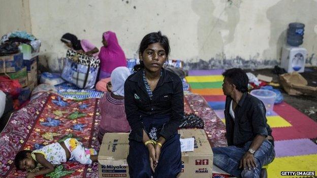 A Rohingya woman sits inside a temporary shelter in Indonesia