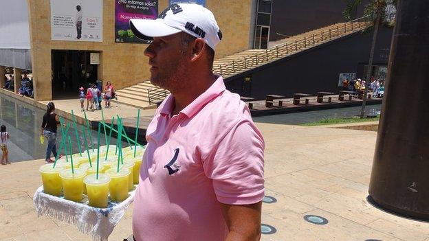 Man selling drinks in the park