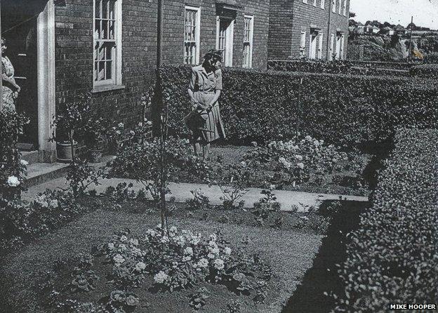 Woman tending to garden on the Becontree Estate