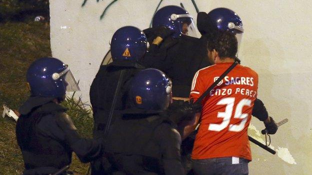 Benfica fans and riot police