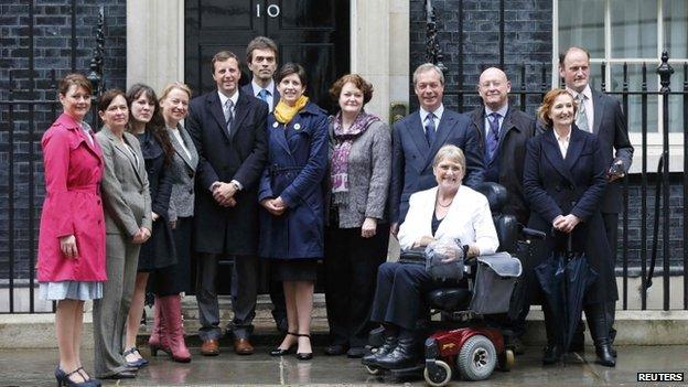A cross-party group made up of political representatives and MPs present an electoral reform petition to 10 Downing Street
