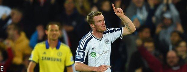 Chris Brunt celebrates his goal