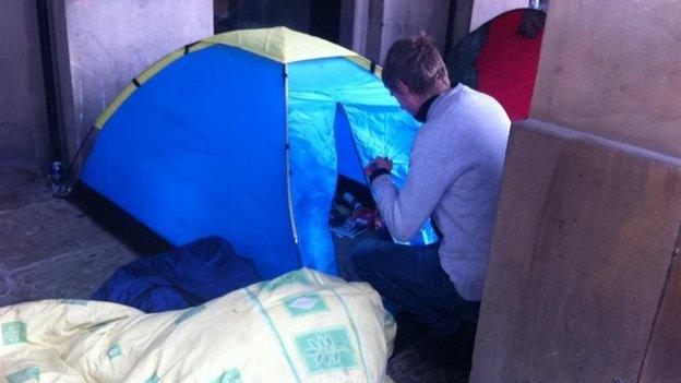 Protester tidying away his things