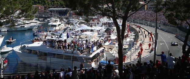 Fans watch from the harbourside at the Monaco Grand Prix