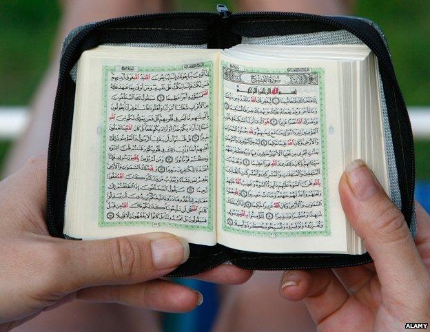 Woman reading Koran