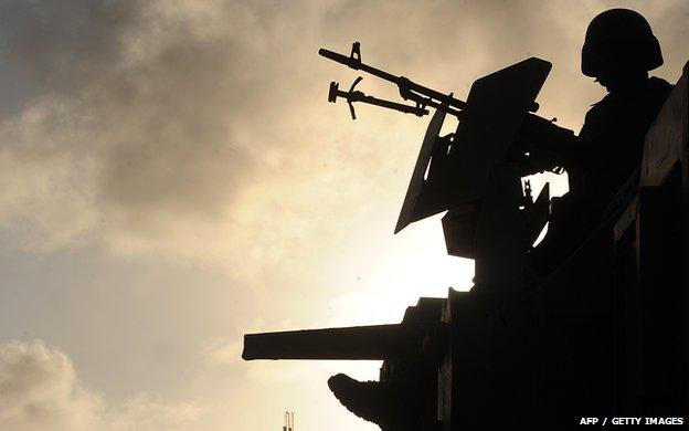 A soldier in Somalia mans a machine gun 14 September 2012