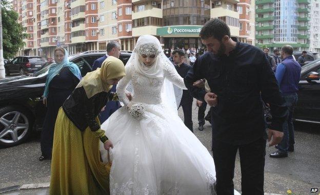 Kheda Goylabiyeva, is taken by head of the Chechen leader's administration Magomed Daudov to a wedding registry office for her wedding with Chechen police officer Nazhud Guchigov