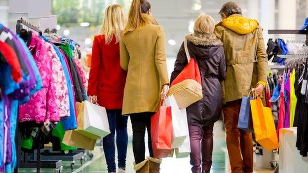 People shopping in clothing store