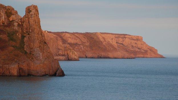 Taken from Nicholaston Burrows (Oxwich Bay) on the Gower, one shows the sunset over Penrice the other is the cliffs of Great To and beyond bathed in the sunset.