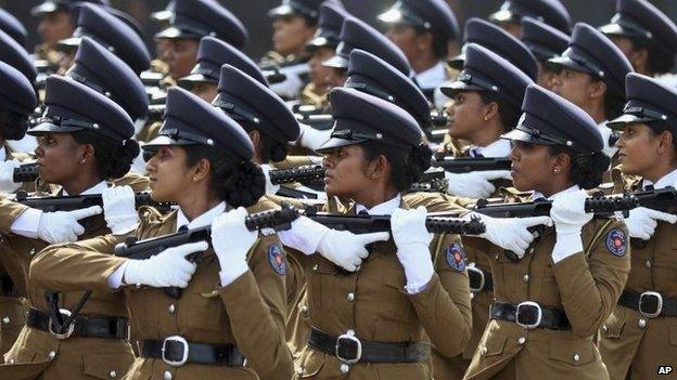 Sri Lankan women police officers march during a parade in Matara, about 165 kilometers (103 miles) south of Colombo, Sri Lanka, Tuesday, May 19, 2015.