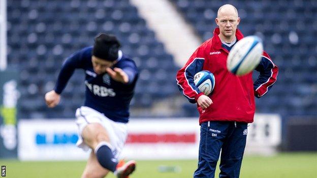 Duncan Hodge watches Greig Laidlaw practise his kicking