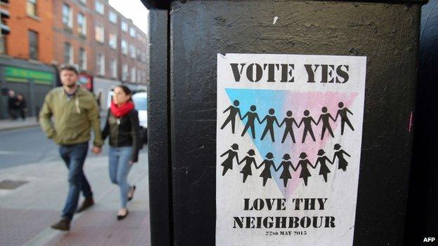 A campaign poster encouraging voters to say yes to same-sex marriage is seen in a Dublin street ahead of a referendum