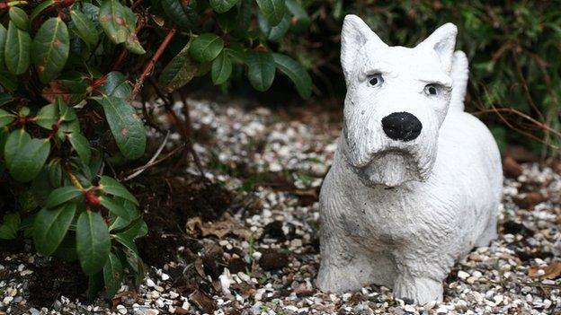 A dog sculpture at a pet cemetery