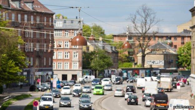 The street lamps hanging above a Copenhagen street