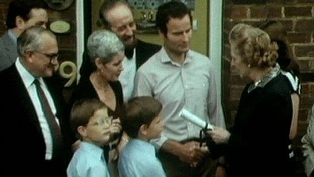 Margaret Thatcher hands over deeds to one of the first council houses bought under the 'Right To Buy' scheme