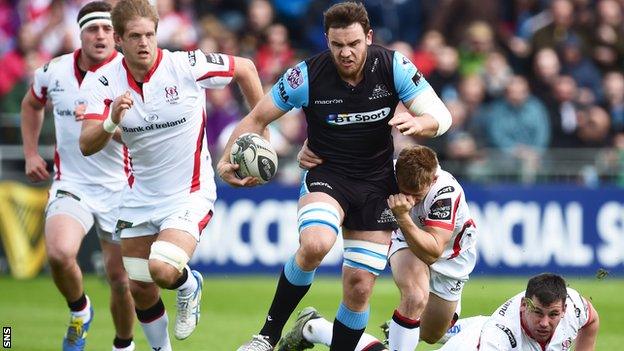 Adam Ashe of Glasgow Warriors leaves Ulster defenders in his wake