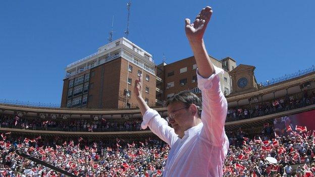 Valencian Socialist Party (PSPV) candidate for regional government presidency Ximo Puig waves during a PSOE campaign meeting for the regional and municipal election at Valencia's bullring on May 16, 2015