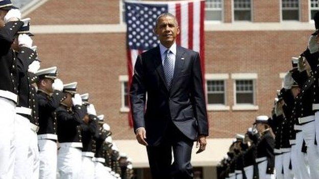 U.S. President Barack Obama walks through an honor cordon as the arrives for the 134th Commencement Exercises of the United States Coast Guard Academy in New London, Connecticut May 20, 2015.