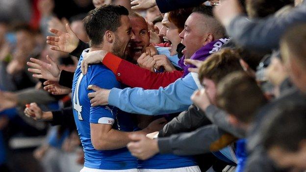 Rangers players celebrate with the fans