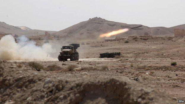 Syrian rocket launcher shell on enemy positions in the ancient oasis city of Palmyra, 19 May