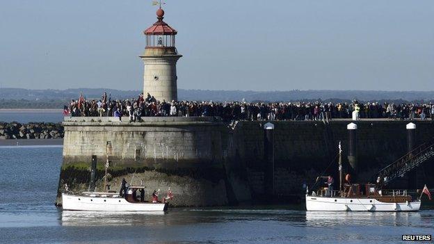 Crowds watch from the harbour wall as "Little Ships" begin their journey across the English Channel