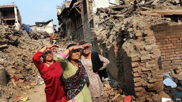 Nepalese earthquake survivors salvage belongings from their houses in devastated Bhaktapur on the outskirts of Kathmandu
