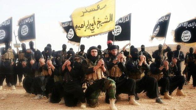 Islamic State fighters pose for a photo (1 June 2014)