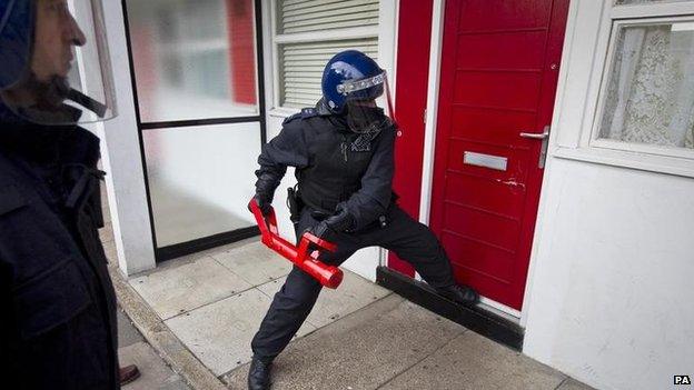 Generic police breaking down door