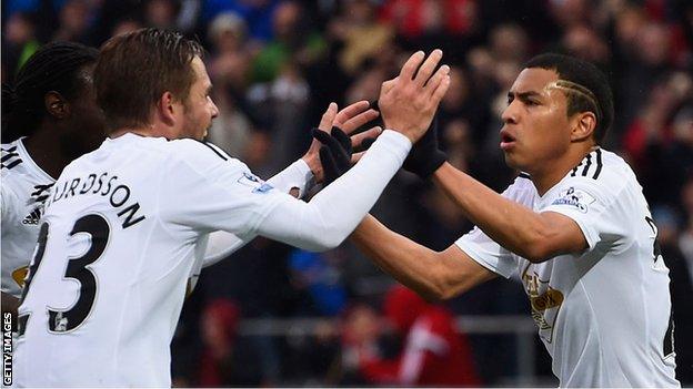 Gylfi Sigurdsson and Jefferson Montero celebrate a Swansea goal